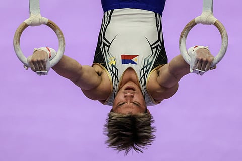Philippines' Carlos Edriel Yulo competes on the rings in the men's artistic gymnastics team final during the 2026 Asian Games at the Nagoya City General Gymnasium in Nagoya, Aichi prefecture on September 23, 2026.