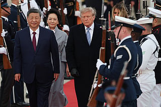 Chinese President Xi Jinping, First lady of China Peng Liyuan, U.S. President Donald Trump, and First Lady Melania Trump walk on the red carpet during an arrival ceremony on September 23, 2026, at Joint Base Andrews, Maryland.