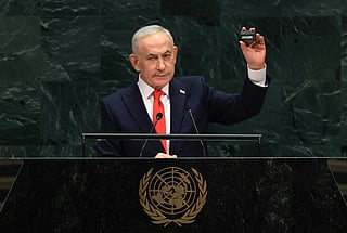 Israel's Prime Minister Benjamin Netanyahu holds up a pager as he speaks during the 81st United Nations General Assembly at the United Nations Headquarters in New York, on September 24, 2026.