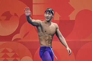 Gold medallist Japan's Shin Ohashi celebrates after breaking the world record while competing in the final of the men's 200m breaststroke swimming event during the 2026 Asian Games at the Tokyo Aquatics Centre in Tokyo on September 24, 2026.