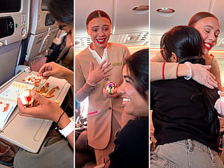 An Emirates cabin crew member reacts emotionally after receiving a handmade LEGO creation from a passenger during a flight. 
