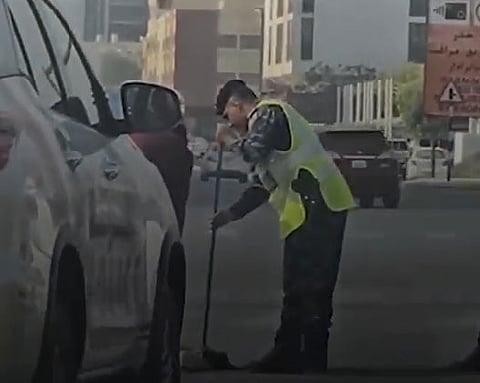 UAE police officer goes viral for sweeping debris after Ras Al Khaimah accident