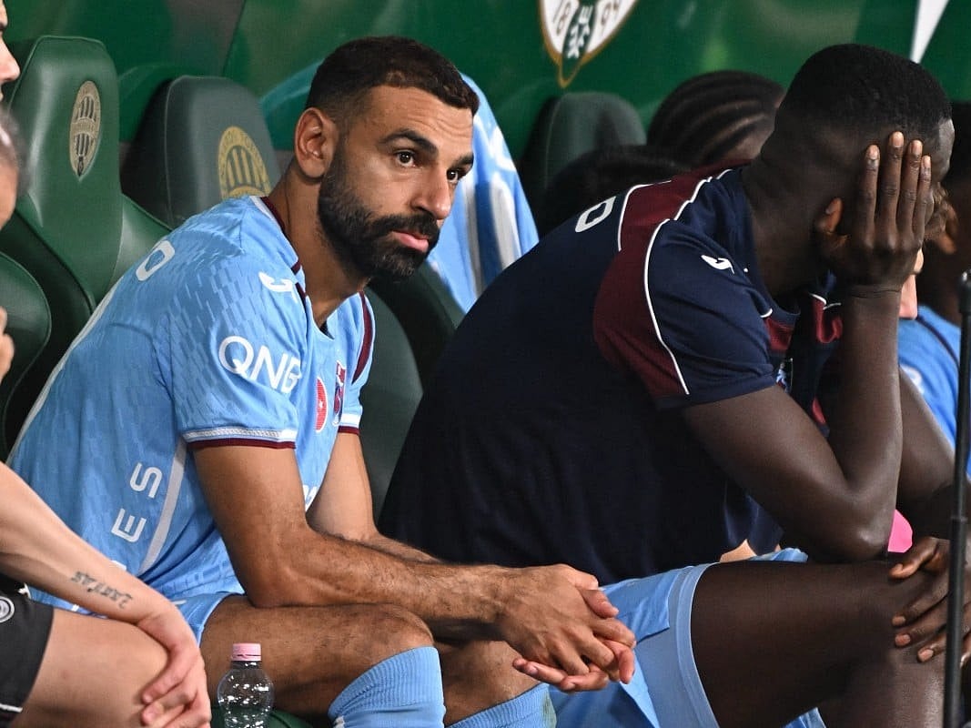 Trabzonspor's Egyptian forward #10 Mohamed Salah sits on the bench after being substituted during the UEFA Europa League second leg playoff football match between Ferencvaros and Trabzonspor in Budapest on August 27, 2026.