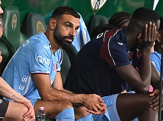 Trabzonspor's Egyptian forward #10 Mohamed Salah sits on the bench after being substituted during the UEFA Europa League second leg playoff football match between Ferencvaros and Trabzonspor in Budapest on August 27, 2026.