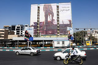 A giant billboard erected on the facade of a building depicting a member of Iran's Islamic Revolutionary Guards Corps (IRGC) placing his foot on a US sea drone, reportedly seized by Iran in the Strait of Hormuz, is pictured in Vanak Square in Tehran on September 24, 2026.