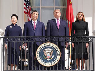 President Donald Trump, center right, first lady Melania Trump, right, China's President Xi Jinping, center left, and his wife Peng Liyuan watch a silent drill platoon review on the new helipad from the Blue Room Balcony of the White House, Thursday, Sept. 24, 2026, in Washington.