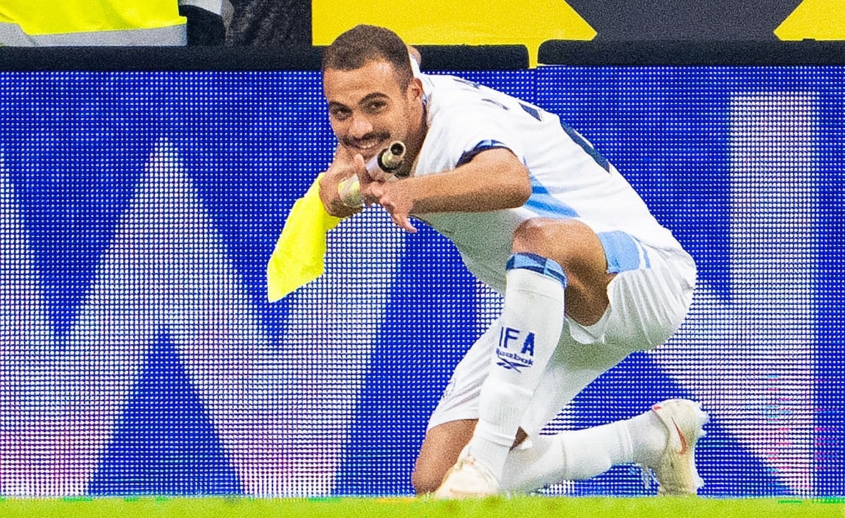 Israel's forward #22 Saied Abu Farchi celebrates scoring his team's first goal while holding a pitch flag pole during the UEFA Nations League Group B3 football match between Austria and Israel in Linz, Austria on September 24, 2026.
