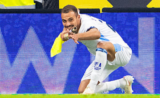 Israel's forward #22 Saied Abu Farchi celebrates scoring his team's first goal while holding a pitch flag pole during the UEFA Nations League Group B3 football match between Austria and Israel in Linz, Austria on September 24, 2026.