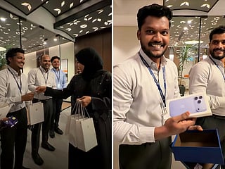 A UAE businessman surprises employees with iPhones after initially giving some chocolate gift boxes. The employees' reactions were captured in a viral video.
