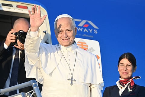 Pope Leo XIV boards his plane heading to Paris at Rome's Fiumicino airport on September 25, 2026.