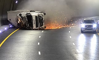 Footage of the serious accident shows the truck entering the tunnel before overturning onto its left side near a bend in the road. 