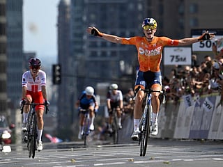 Netherlands's Demi Vollering (R) celebrates at finish line after winning the Women Elite Road Race during the 2026 Union Cycliste Internationale (UCI) Road World Championships in Montreal, Quebec, on September 26, 2026.