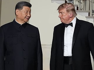 US President Donald Trump and China's President Xi Jinping walk in the Grand Foyer of the White House during a State Dinner, Thursday, Sept. 24, 2026, in Washington. 