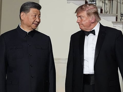 US President Donald Trump and China's President Xi Jinping walk in the Grand Foyer of the White House during a State Dinner, Thursday, Sept. 24, 2026, in Washington. 