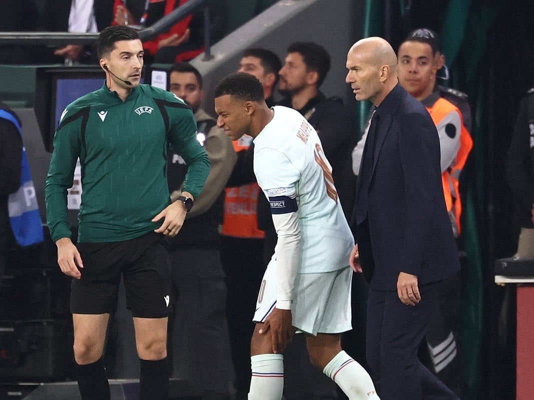 France's Kylian Mbappe (C) reacts after picking up an injury following his team's first goal, next to France's head coach Zinedine Zidane during the UEFA Nations League (League A, Group 1) first leg football match between Turkey and France at the Kocaeli Stadium in Izmit, on September 25, 2026.