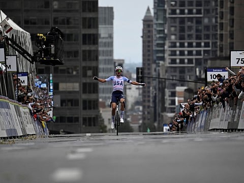 The United States' Brandon McNulty celebrates winning the Men Elite Road Race during the 2026 Union Cycliste Internationale (UCI) Road World Championships in Montreal, Quebec, on September 27, 2026.