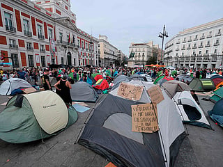 Demonstrators camp with tents to protest against evictions and the housing crisis in front of the Presidency of the Community of Madrid on the Puerta del Sol plaza in Madrid.