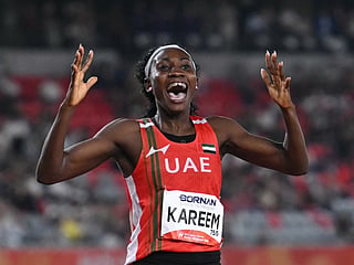 United Arab Emirates' Mariam Kareem celebrates setting a games record to win the women's 400m hurdles final during the 2026 Asian Games at Nagoya City Mizuho Park Athletic Stadium in Nagoya, Aichi Prefecture on September 28, 2026.