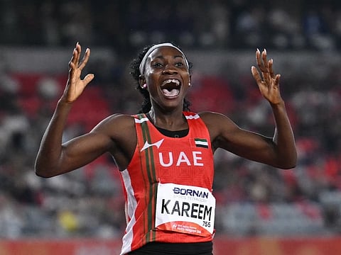 United Arab Emirates' Mariam Kareem celebrates setting a games record to win the women's 400m hurdles final during the 2026 Asian Games at Nagoya City Mizuho Park Athletic Stadium in Nagoya, Aichi Prefecture on September 28, 2026.