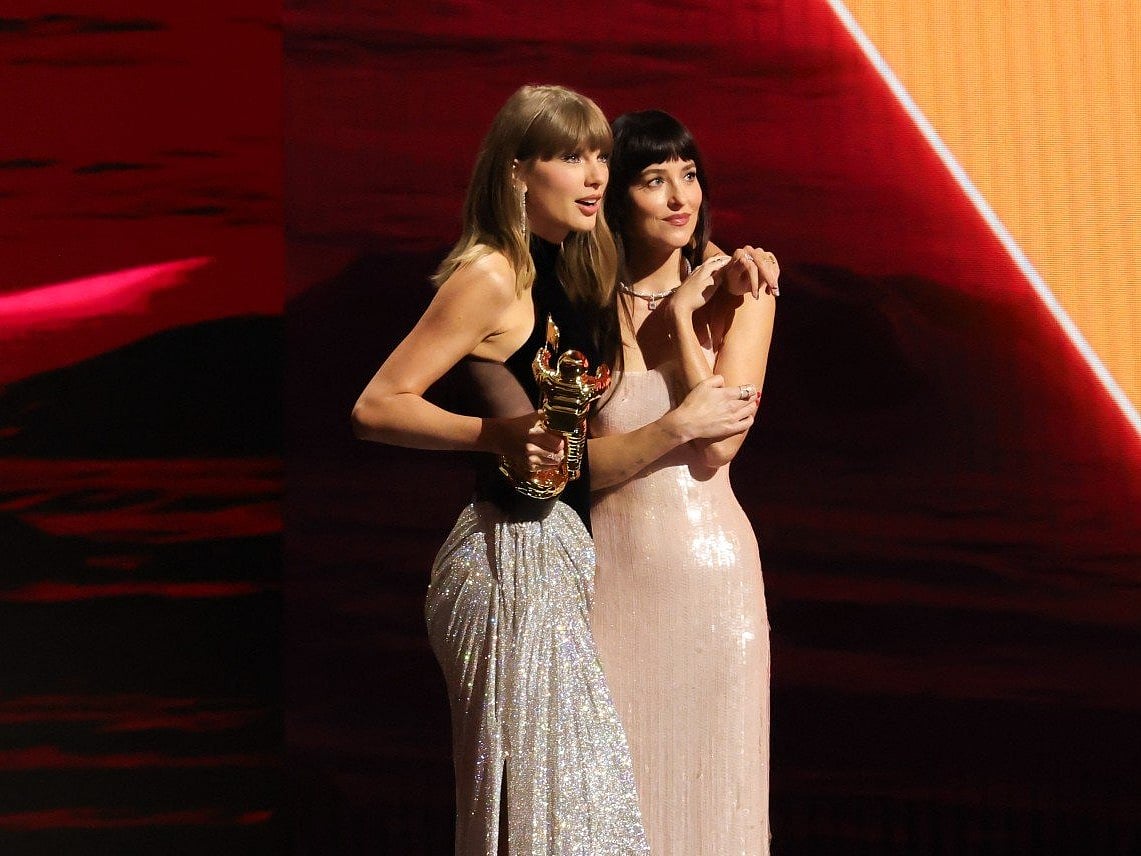 Taylor Swift accepts the Artist Director Honors from Dakota Johnson onstage during the 2026 MTV Video Music Awards (VMAs) at Peacock Theater on September 27, 2026 in Los Angeles, California.