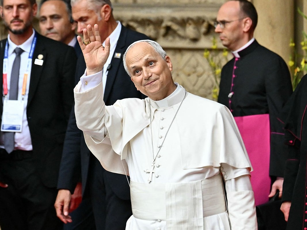Pope Leo XIV waves as he leaves after celebrating a mass at Saint-Etienne de Metz Cathedral, in Metz, northeastern France on September 28, 2026 on the last day of his visit to France.