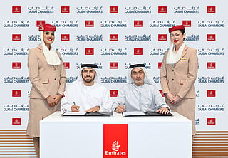 Adnan Kazim, Emirates Deputy President and Chief Commercial Officer and Khalid AlJarwan, Executive Vice President of Commercial and Corporate Services at Dubai Chambers sign an agreement. 