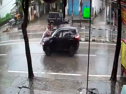 Man clings to car bonnet for nearly 2km as driver keeps going after crash
