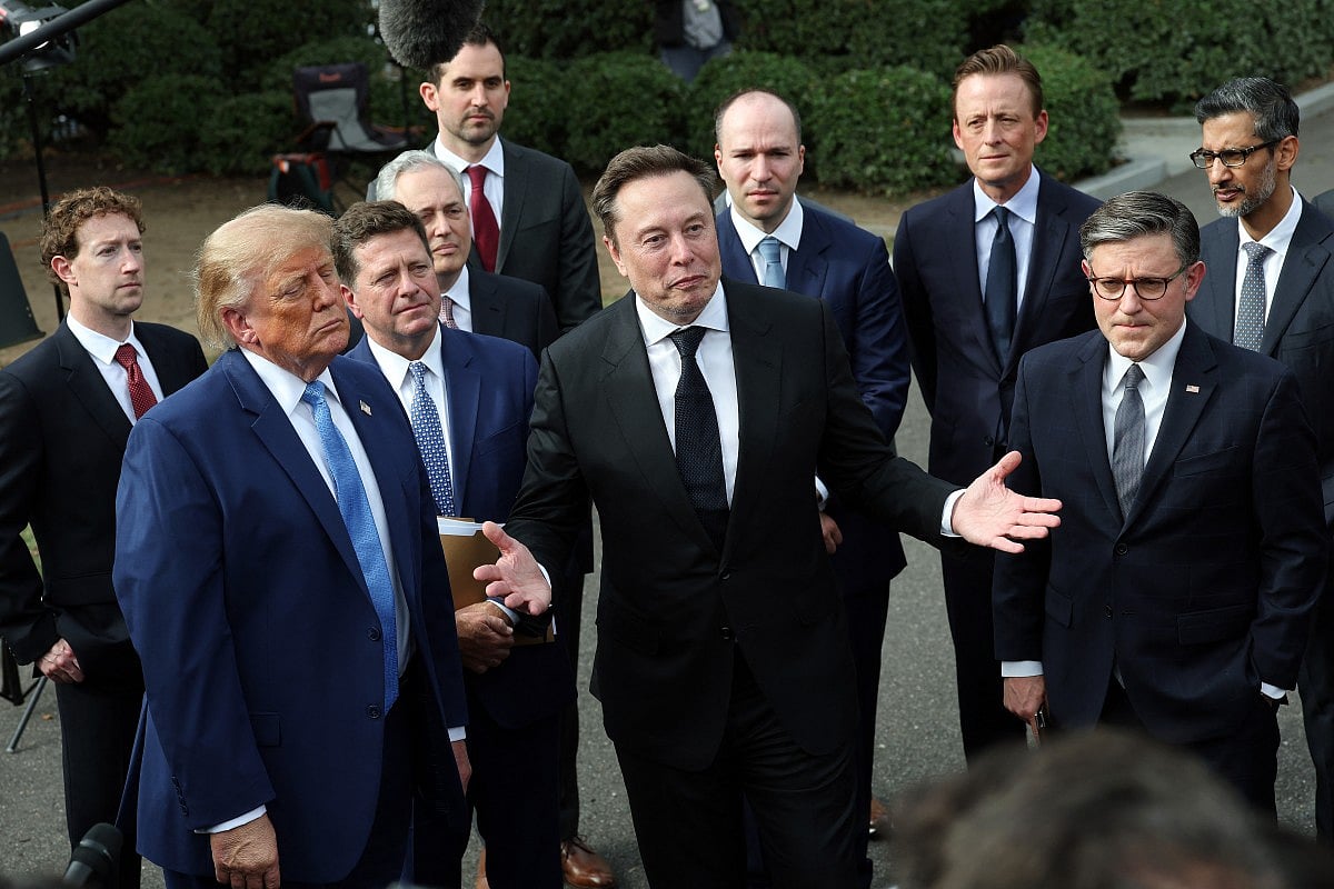Elon Musk, CEO of Tesla and SpaceX, stands with U.S. President Donald Trump, Mark Zuckerberg, CEO of Meta Platforms, Speaker of the House Mike Johnson (R-LA) and others holds a press briefing with AI executives following a meeting on artificial intelligence outside the West Wing of the White House on September 29, 2026 in Washington, DC. The meeting comes as some have called for a slowdown in AI development amid rising safety concerns.