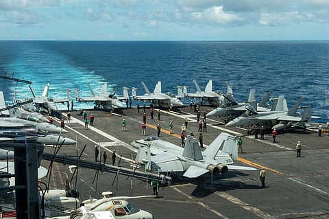 FILE - In this photograph released by the U.S. Navy, military planes stand on the flight deck of the Nimitz-class aircraft carrier USS Theodore Roosevelt, July 4, 2024, in the South China Sea. (Seaman Ryan Holloway/U.S. Navy, via AP, File)