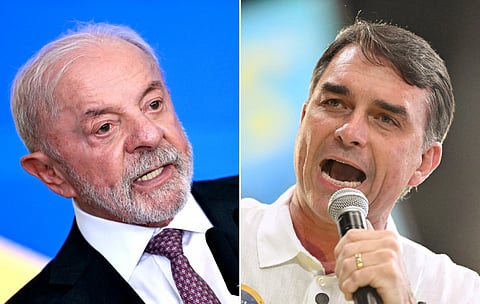 This combination of file pictures created on Setember 29, 2026, shows Brazil's President Luiz Inacio Lula da Silva at the Planalto Palace in Brasilia on September 16, 2026; and Brazil's right-wing Presidential candidate Flavio Bolsonaro at the Maracanazinho gymnasium in Rio de Janeiro, Brazil, on August 22, 2026.