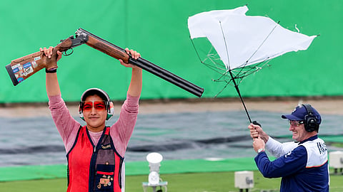 India coach Peter Wilson celebrates Neeru Dhanda's historic Asian Games trap gold, breaking his umbrella in excitement.
