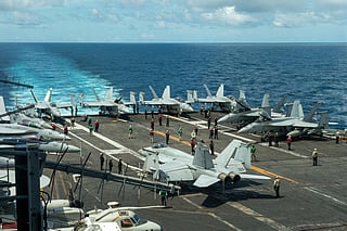 FILE - In this photograph released by the U.S. Navy, military planes stand on the flight deck of the Nimitz-class aircraft carrier USS Theodore Roosevelt, July 4, 2024, in the South China Sea. (Seaman Ryan Holloway/U.S. Navy, via AP, File)