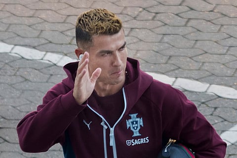 Portugal's forward #07 Cristiano Ronaldo waves to fans as he arrives for a training session at Parken stadium in Copenhagen, Denmark, on September 30, 2026, on the eve of their Nations League Group A4 match against Denmark.