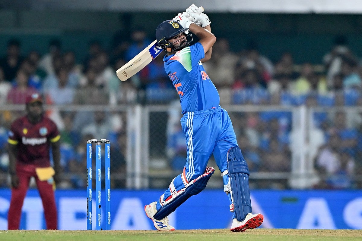 India's Rohit Sharma watches the ball after playing a shot during the second one-day international (ODI) cricket match between India and West Indies at the Barsapara Cricket Stadium in Guwahati on September 30, 2026.