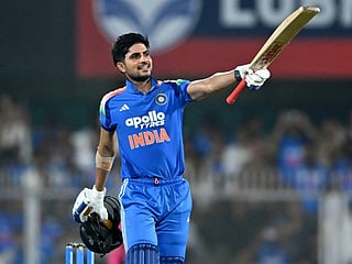 India's captain Shubman Gill celebrates after scoring a century (100 runs) during the second one-day international (ODI) cricket match between India and West Indies at the Barsapara Cricket Stadium in Guwahati on September 30, 2026.