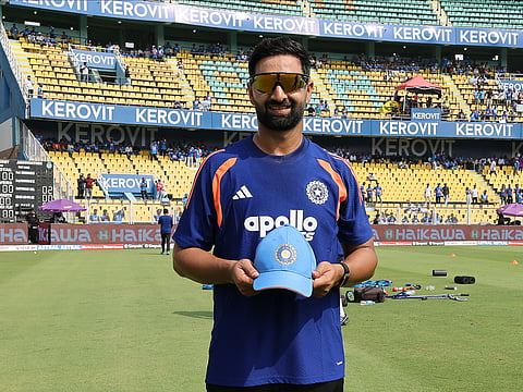Auqib Nabi with his debut cap