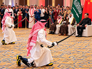 Chinese humanoid robots dressed in traditional Saudi attire perform the Ardah sword dance during a reception hosted by the Chinese Embassy in Riyadh.
