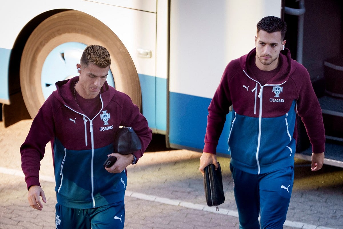 Portugal's forward #07 Cristiano Ronaldo (L) and Portugal's defender #02 Diogo Dalot arrive for a training session at Parken stadium in Copenhagen, Denmark, on September 30, 2026, on the eve of their Nations League Group A4 match against Denmark.