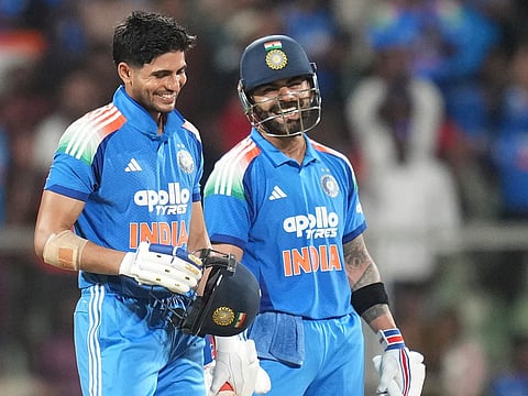 India's captain Shubman Gill, left, celebrates his century with Virat Kohli during the first ODI against West Indies in Thiruvananthapuram, India, Sunday, Sept. 27, 2026. 