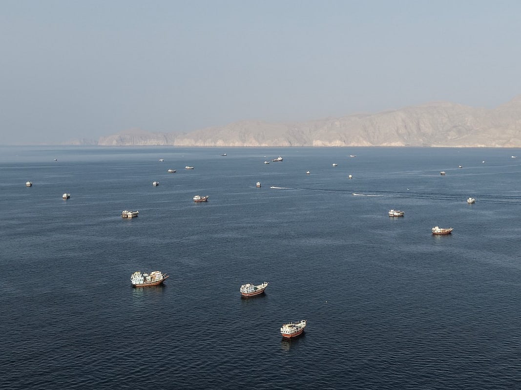 An aerial view shows ships anchored off the coast of Khasab in Oman’s Musandam Governorate, near the Strait of Hormuz, on October 2, 2026.