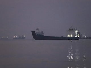 Cargo ships are anchored in the Strait of Hormuz off Bandar Abbas, Iran, before sunrise on Monday, Sept. 28, 2026. 