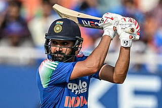 India's Rohit Sharma watches the ball after playing a shot during the third one-day international (ODI) cricket match between India and West Indies at the Maharaja Yadavindra Singh International Cricket Stadium on the outskirts of Chandigarh on October 3, 2026.