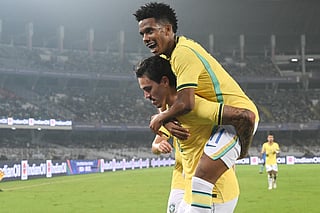 Brazil's forward #19 Pedro (L) celebrates with teammate Brazil's forward #11 Estevao Willian (R) after scoring a goal during the international friendly football match between India and Brazil at the Salt Lake Stadium in Kolkata on October 3, 2026.