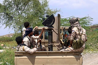 Saudi-backed Yemeni government forces ride in the back of a military truck at the Jabal Han front west of the city of Taiz following fierce battles earlier in the day as Yemen's Houthis reportedly attempted to seize control of the main route between the inland city of Taiz and the coastal city of Aden, on October 3, 2026.