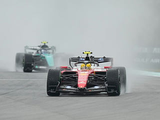 Ferrari driver Lewis Hamilton of Britain steers his car during the formation lap prior to the delayed start of the Bahrain Grand Prix in Sepang, Malaysia, Sunday, Oct. 4, 2026. 