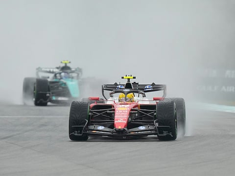 Ferrari driver Lewis Hamilton of Britain steers his car during the formation lap prior to the delayed start of the Bahrain Grand Prix in Sepang, Malaysia, Sunday, Oct. 4, 2026. 