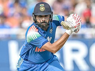 India's Rohit Sharma watches the ball after playing a shot during the third ODI against West Indies at the Maharaja Yadavindra Singh International Cricket Stadium on the outskirts of Chandigarh on October 3, 2026.