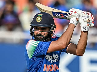 India's Rohit Sharma watches the ball after playing a shot during the third ODI against West Indies at the Maharaja Yadavindra Singh International Cricket Stadium on the outskirts of Chandigarh on October 3, 2026.