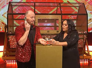 Big Ticket draw hosts Richard and Bouchra trying to reach Bernadette Azucena during the live draw on Saturday night.