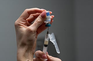 A nurse, prepares a combination measles, mumps and rubella vaccine for a patient at a pediatrics clinic in Easley, South Carolina, March 17, 2026.